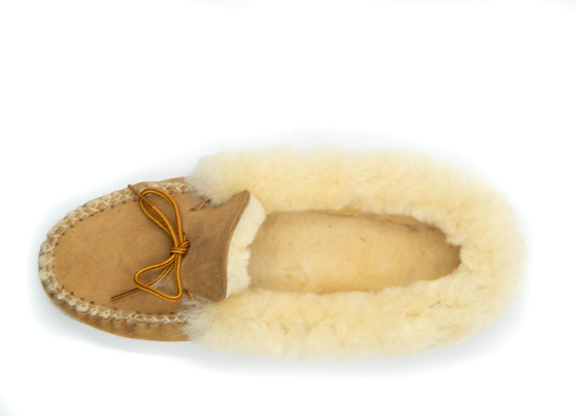 Sheepskin slipper with tan suede sole on a white background