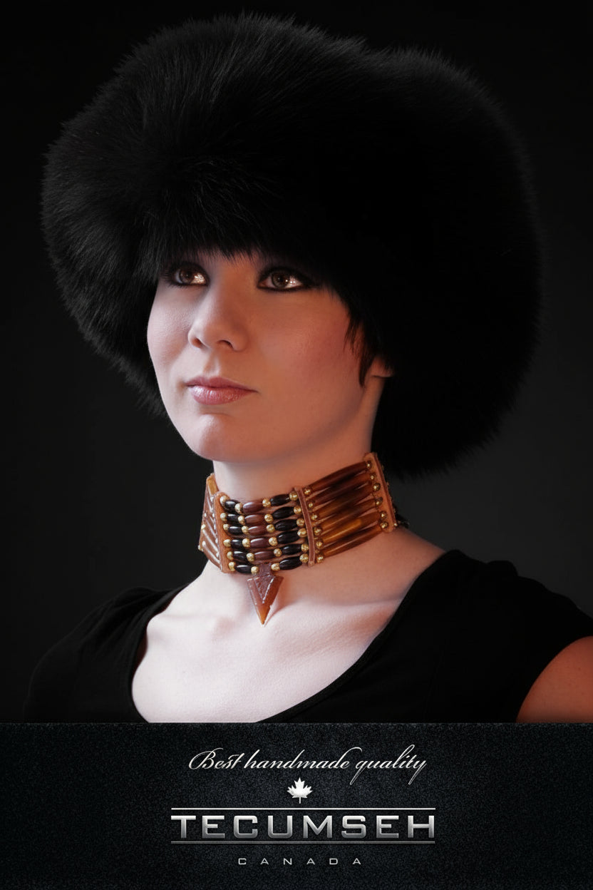 Person wearing a black fur hat and gold necklace with 'Tecumseh Canada' branding.