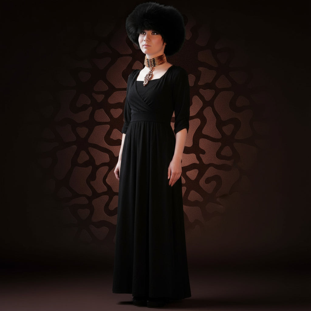 Person wearing a black fur hat and gold necklace against a dark background