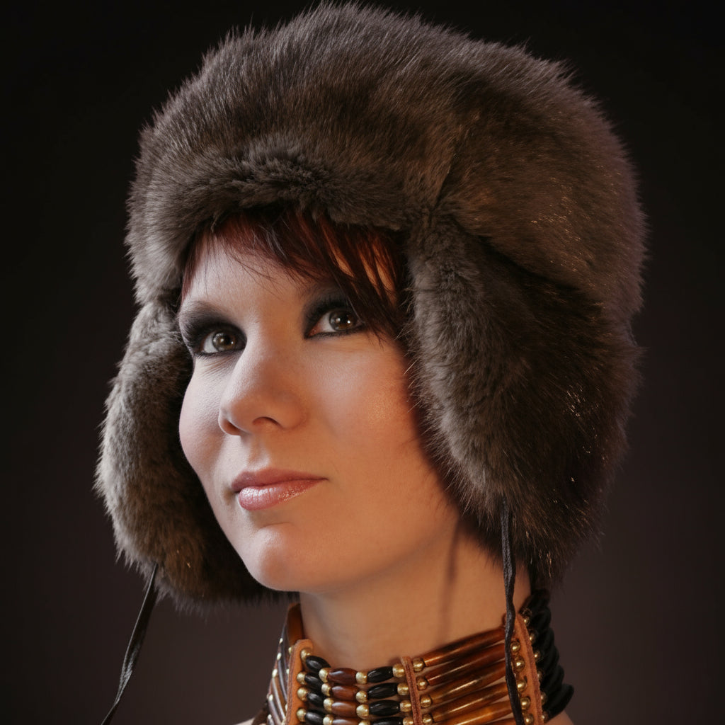 Woman wearing a fur hat with a dark background
