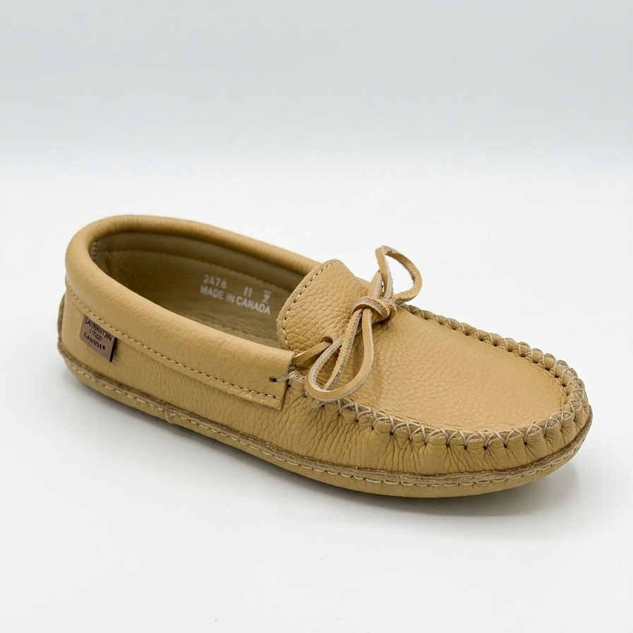 Tan moccasin shoe on a white background