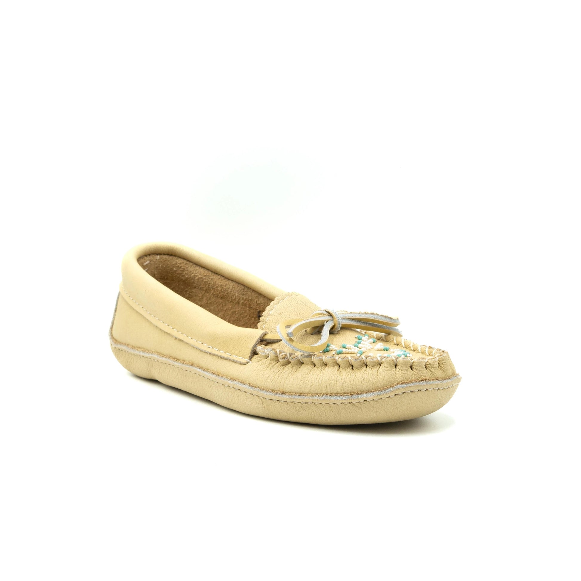 Beige moccasin shoe on a white background