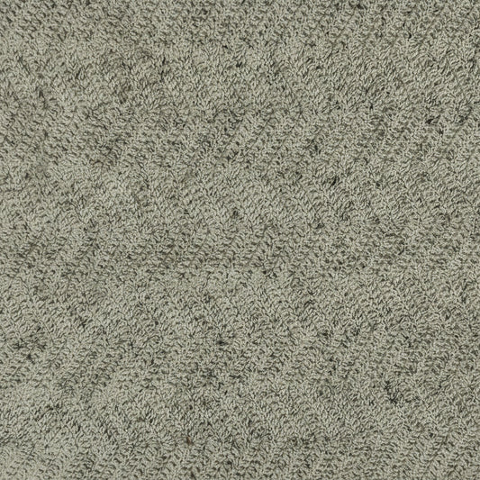 Textured green material swatch on a beige background