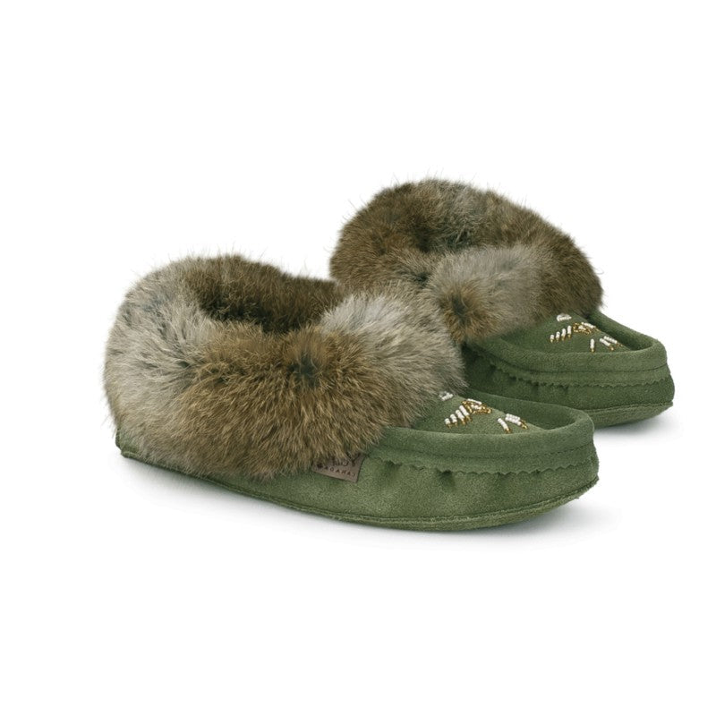 Green slippers with fur trim on a white background