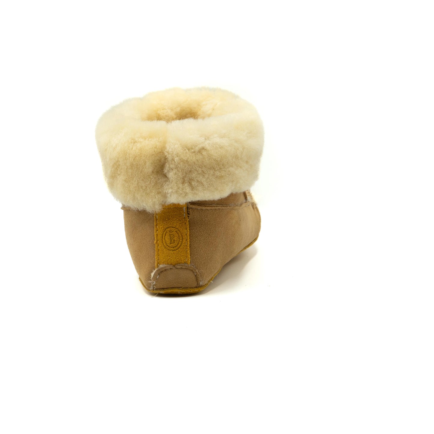 Tan slipper with white fur lining on a white background