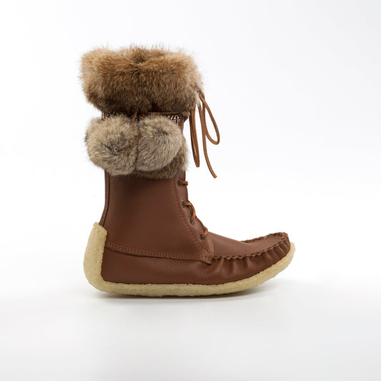 Brown boot with fur pom-poms on a white background