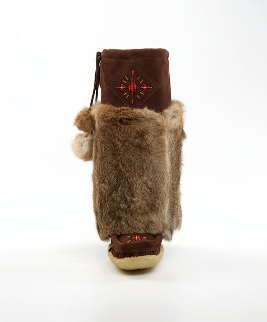 Brown boot with fur trim and embroidered design on a white background