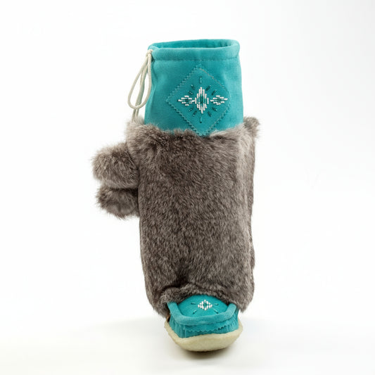 Tall turquoise mukluks with grey rabbit fur on white background