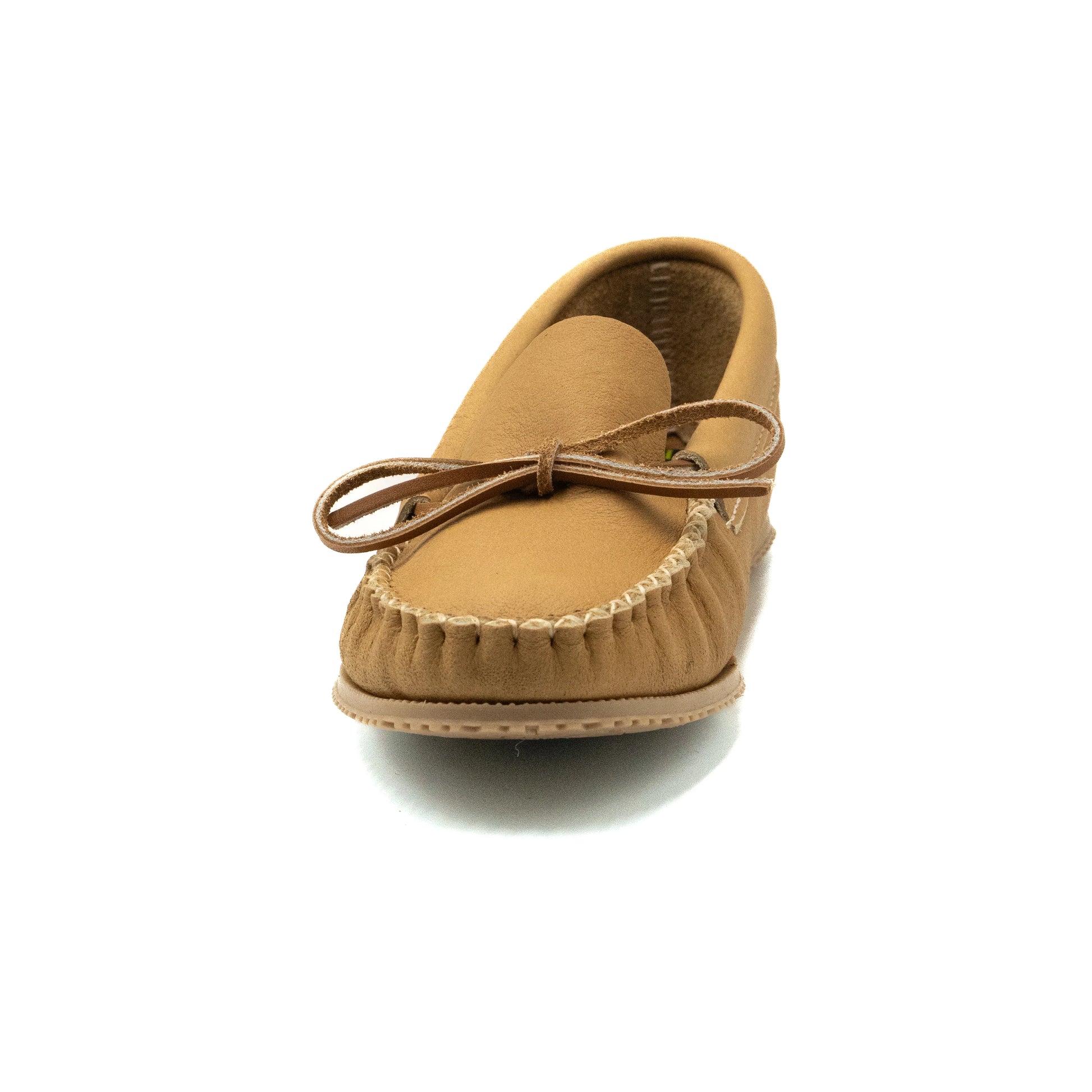 Tan moccasin shoe on a white background