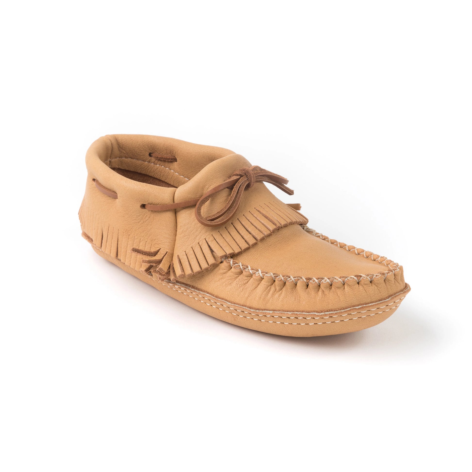 Tan moccasin shoe with fringes on a white background