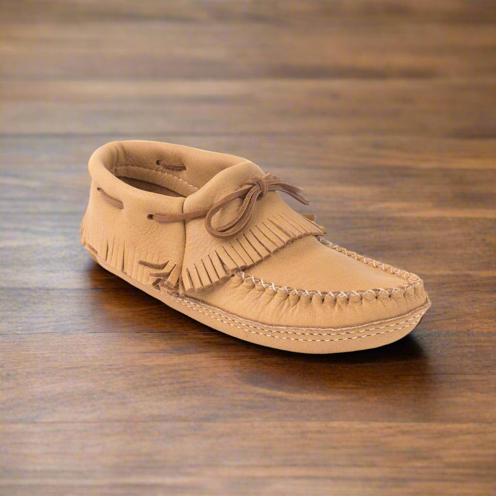 mens fringe moccasins on hardwood floor