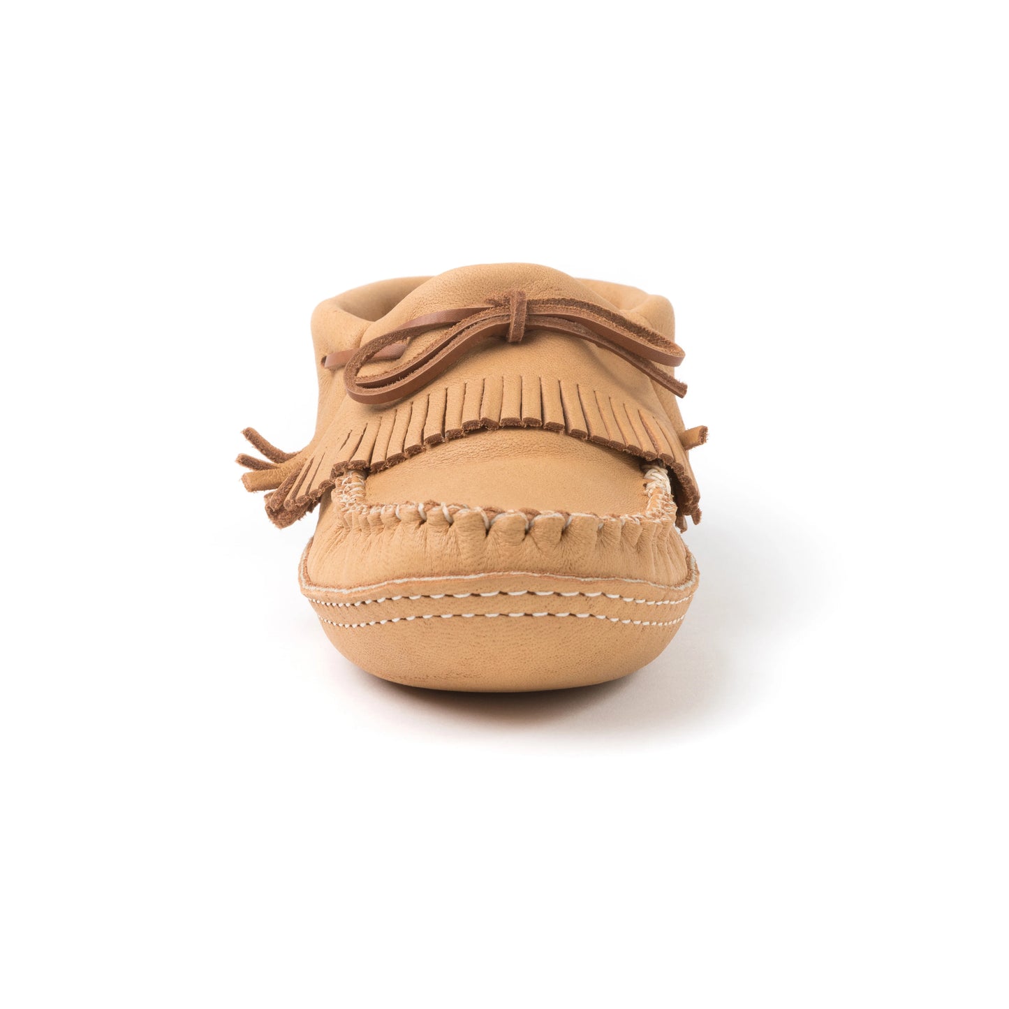 Tan moccasin shoe with fringes on a white background