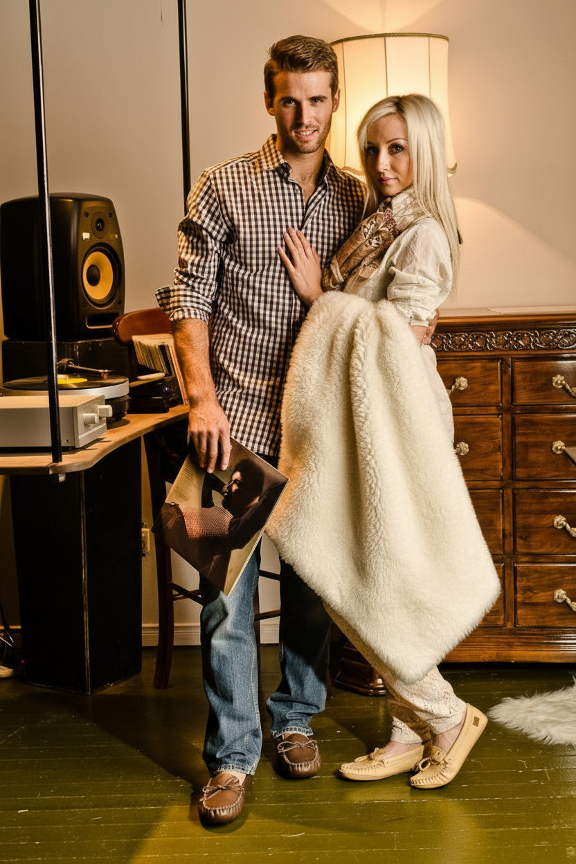 man and woman modeling moccasins