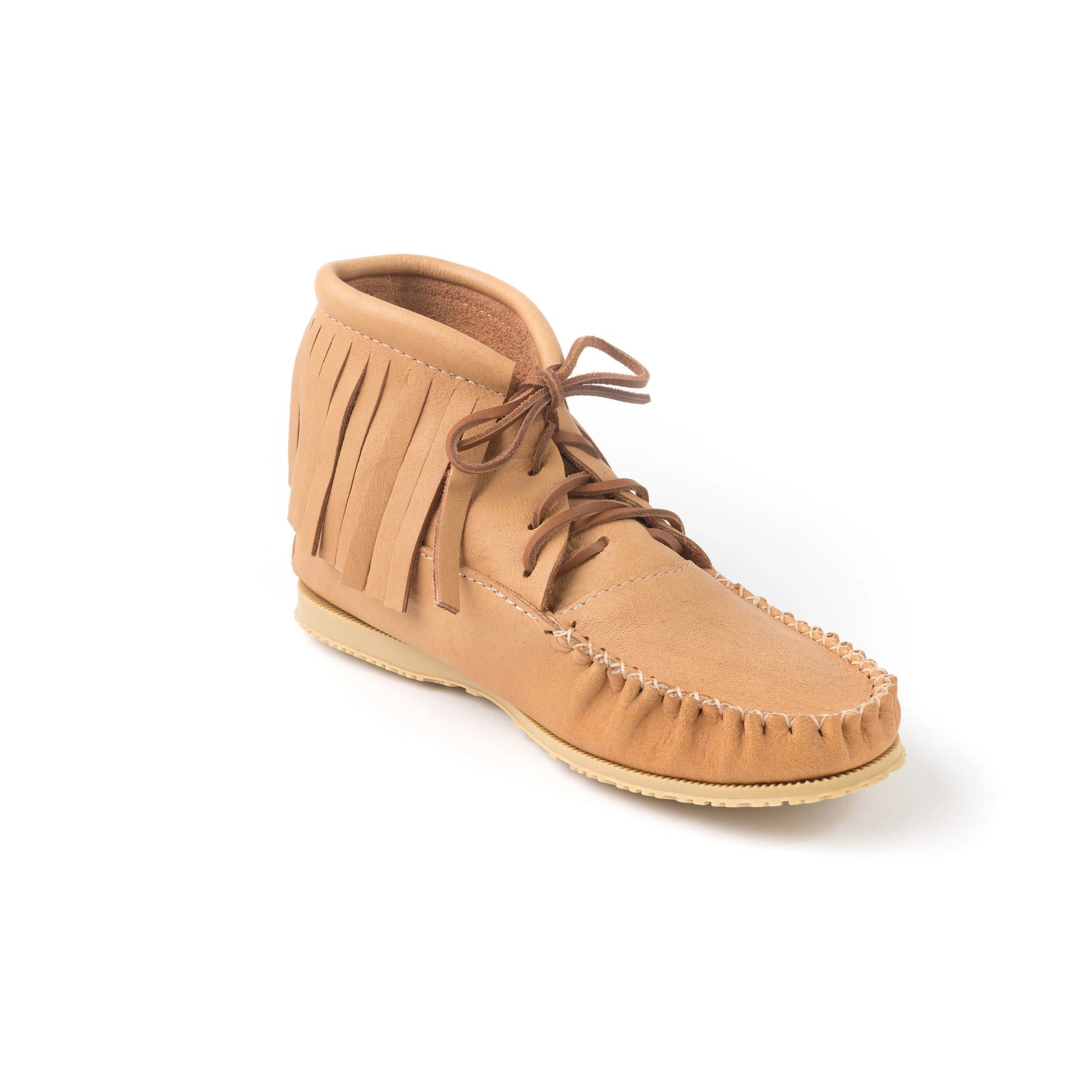 Tan moccasin shoe with fringes on a white background