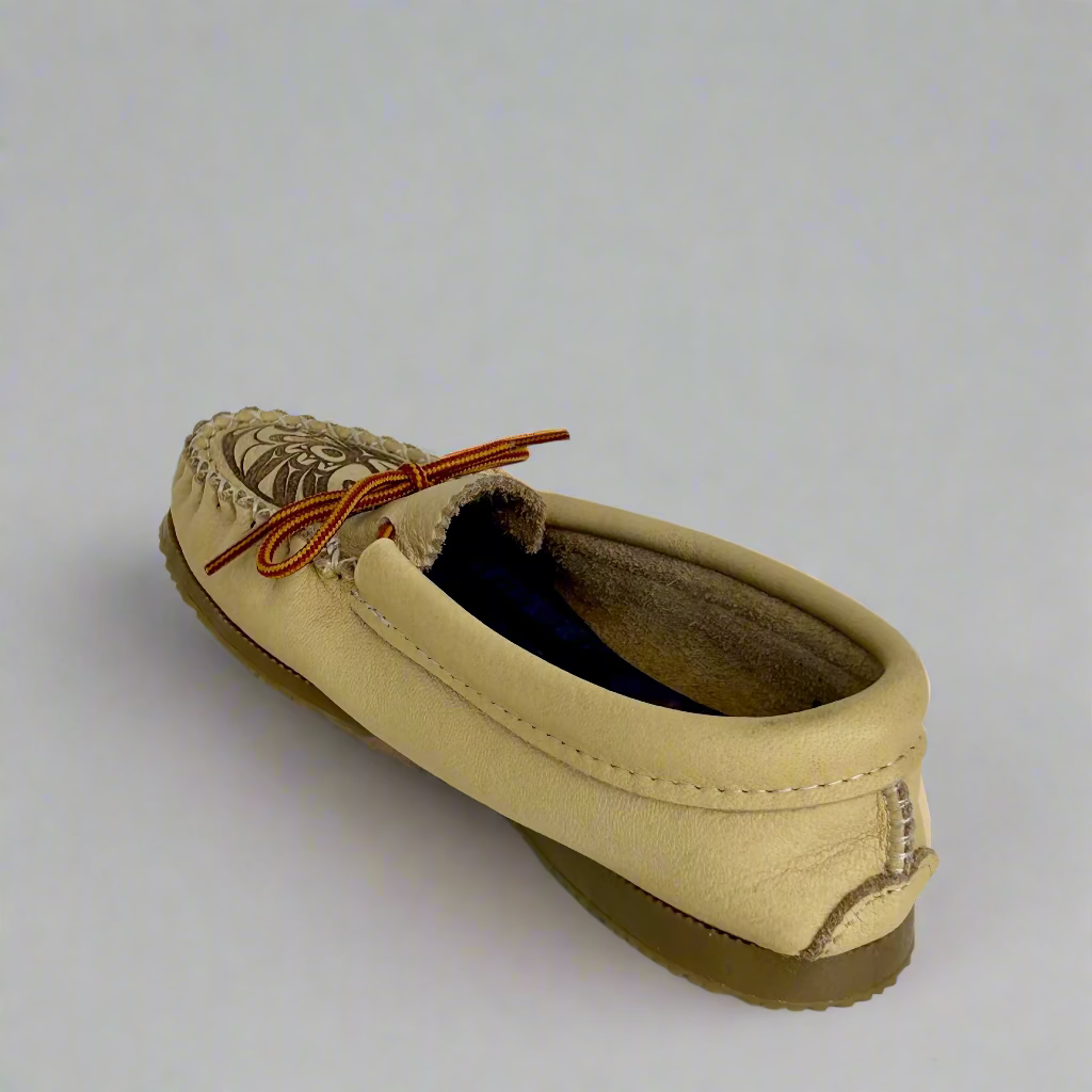 Beige driving moccasin shoe with brown laces on a light gray background