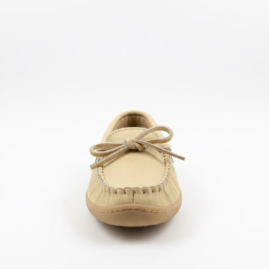 Beige moccasin shoe on a white background