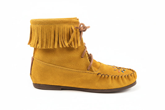 Yellow suede moccasin boot with fringes on a white background