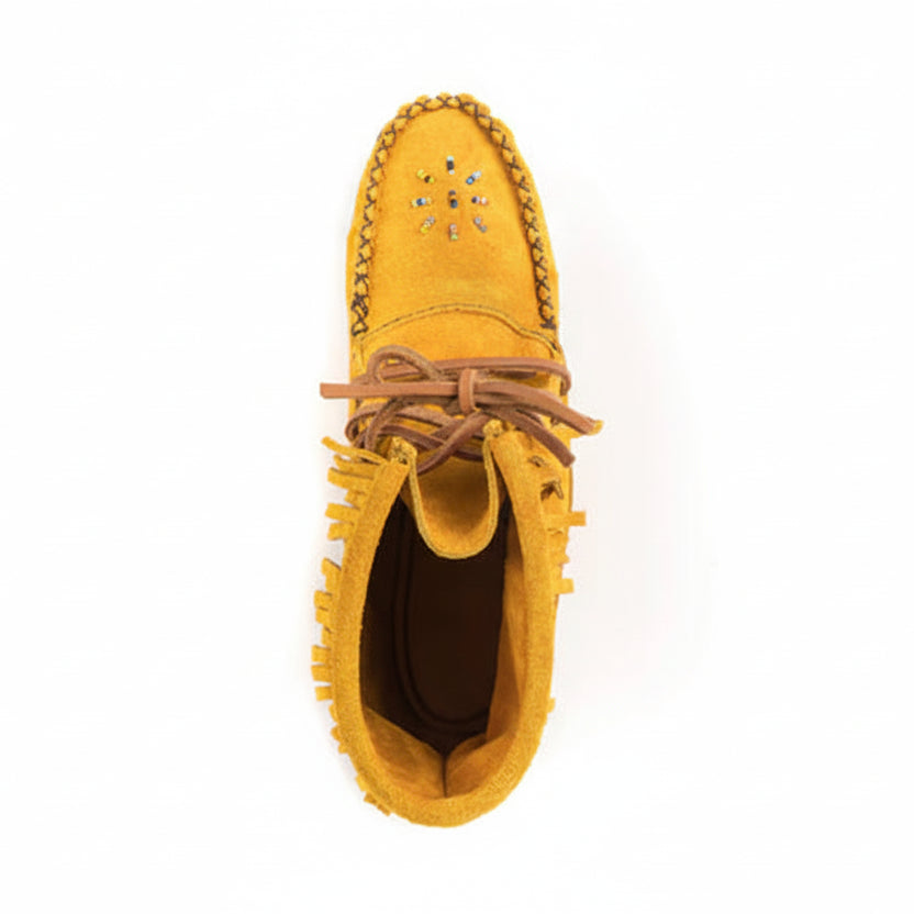 Yellow moccasin shoe with brown laces on a white background