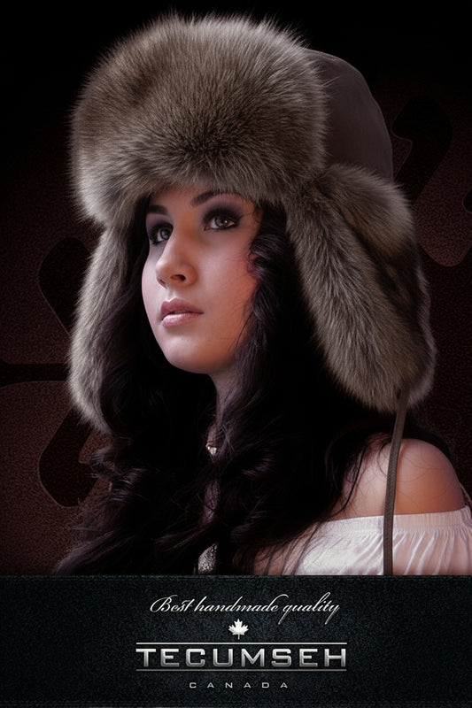 Woman wearing a fur hat with 'Tecumseh Canada' branding on a dark background