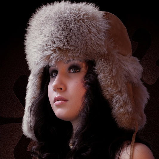 Woman wearing a fur hat against a dark background