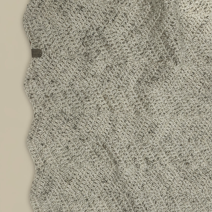 Close-up of textured beige fabric with a subtle pattern