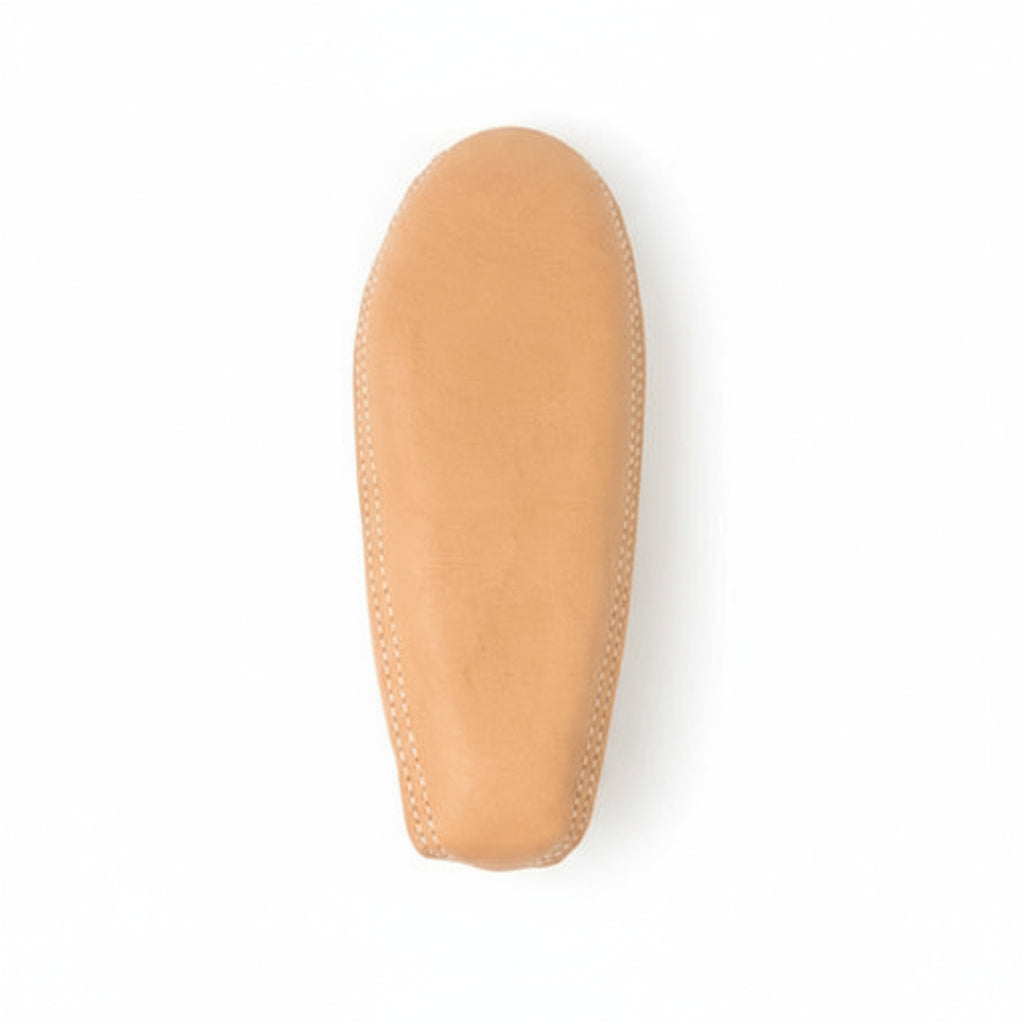 Tan shoe sole on a white background