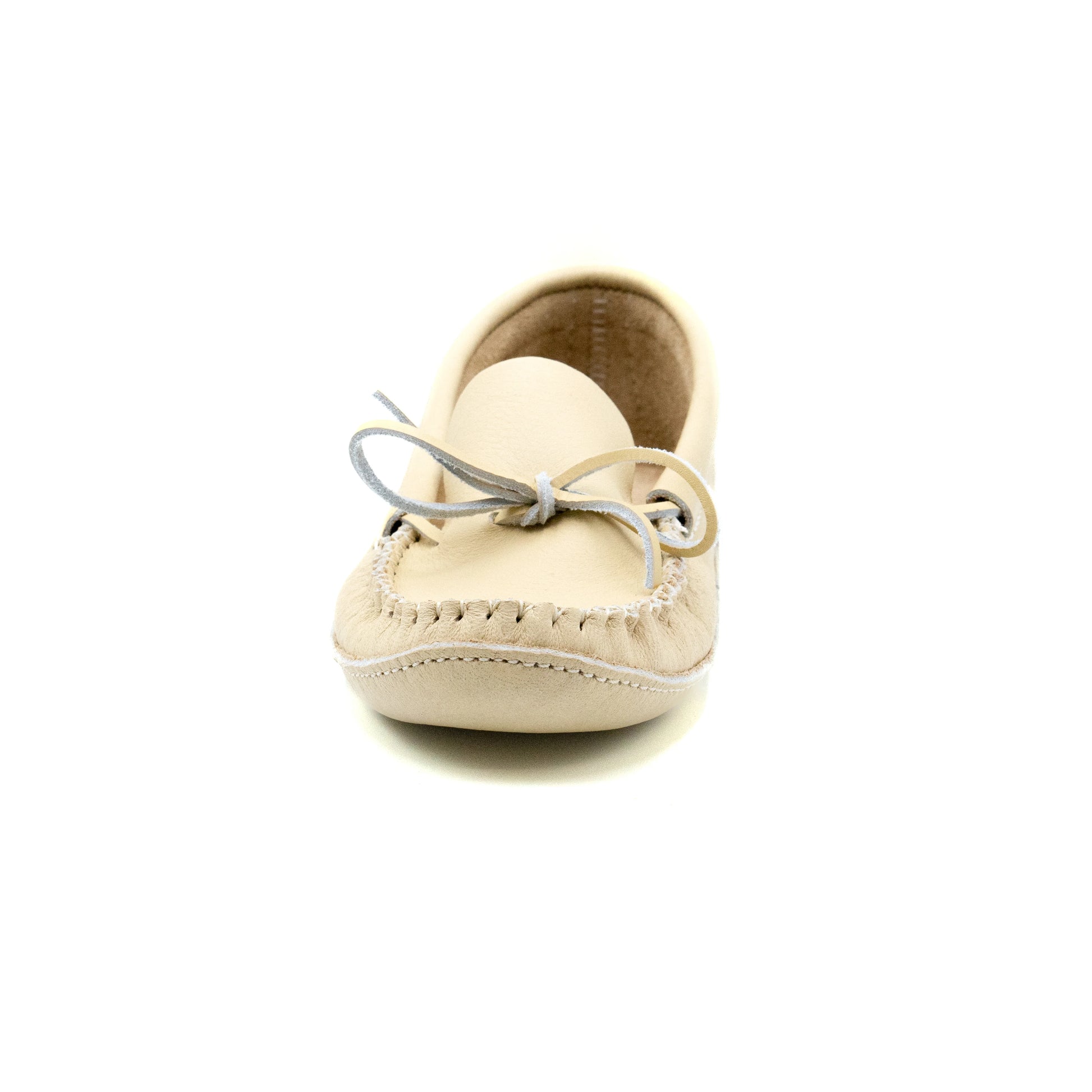 Beige moccasin shoe on a white background