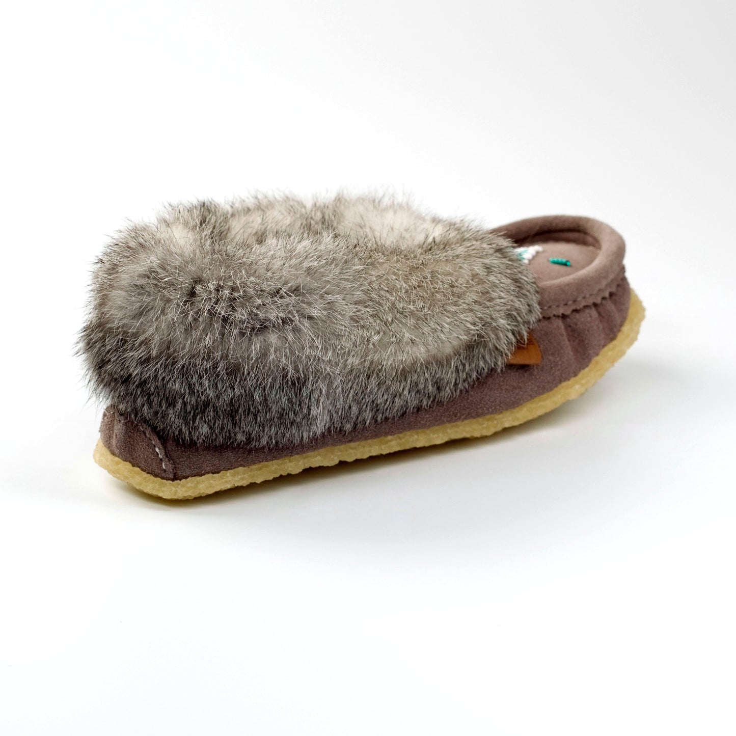 Slipper with fur lining on a white background