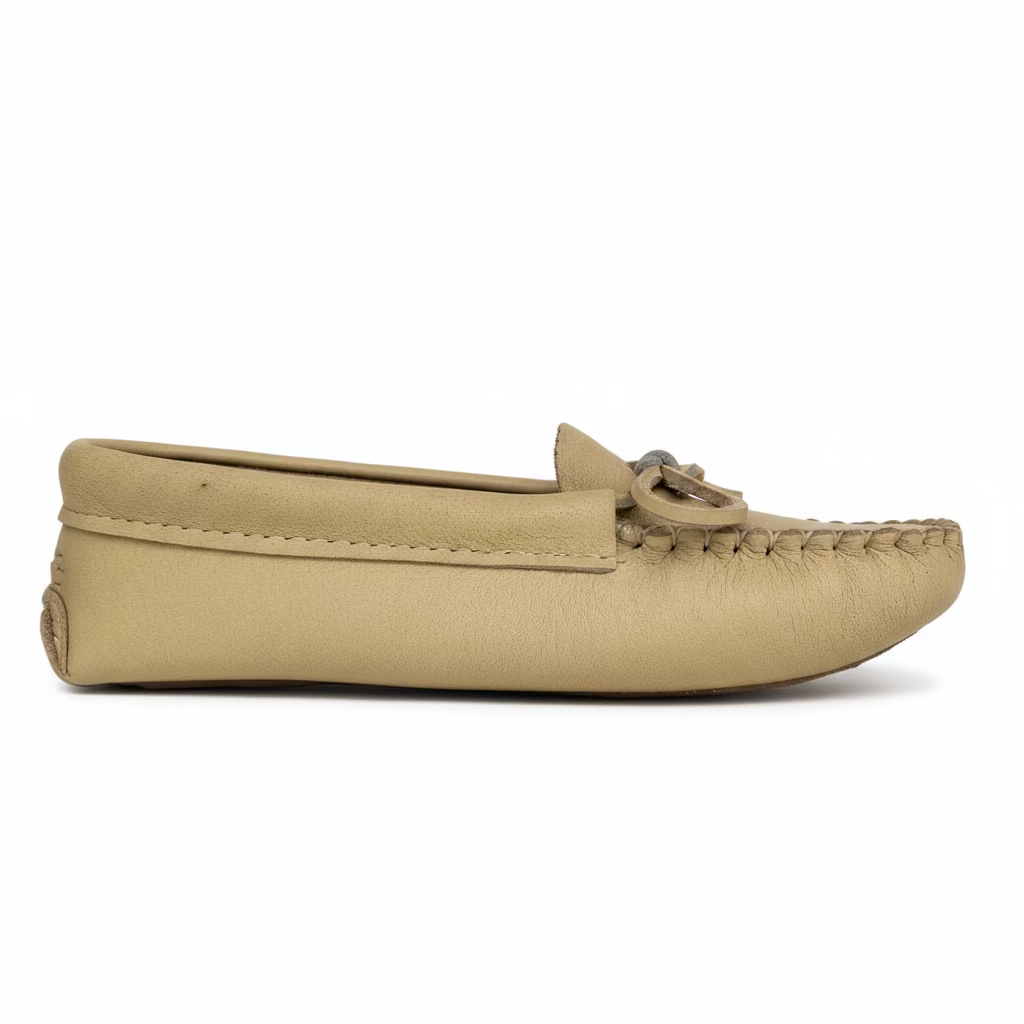 Beige moccasin shoe on a light gray background