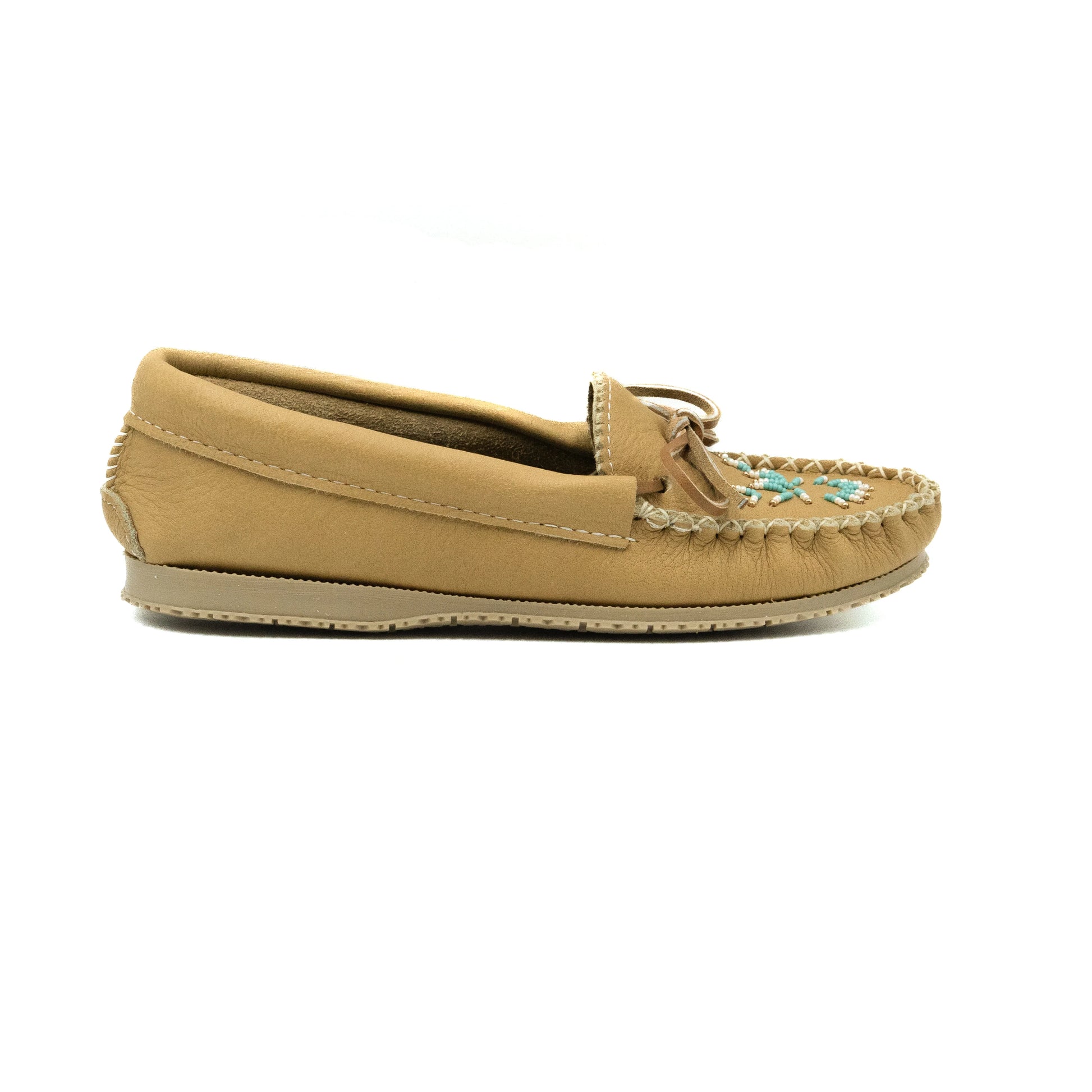 Tan slip-on shoe with decorative elements on a white background