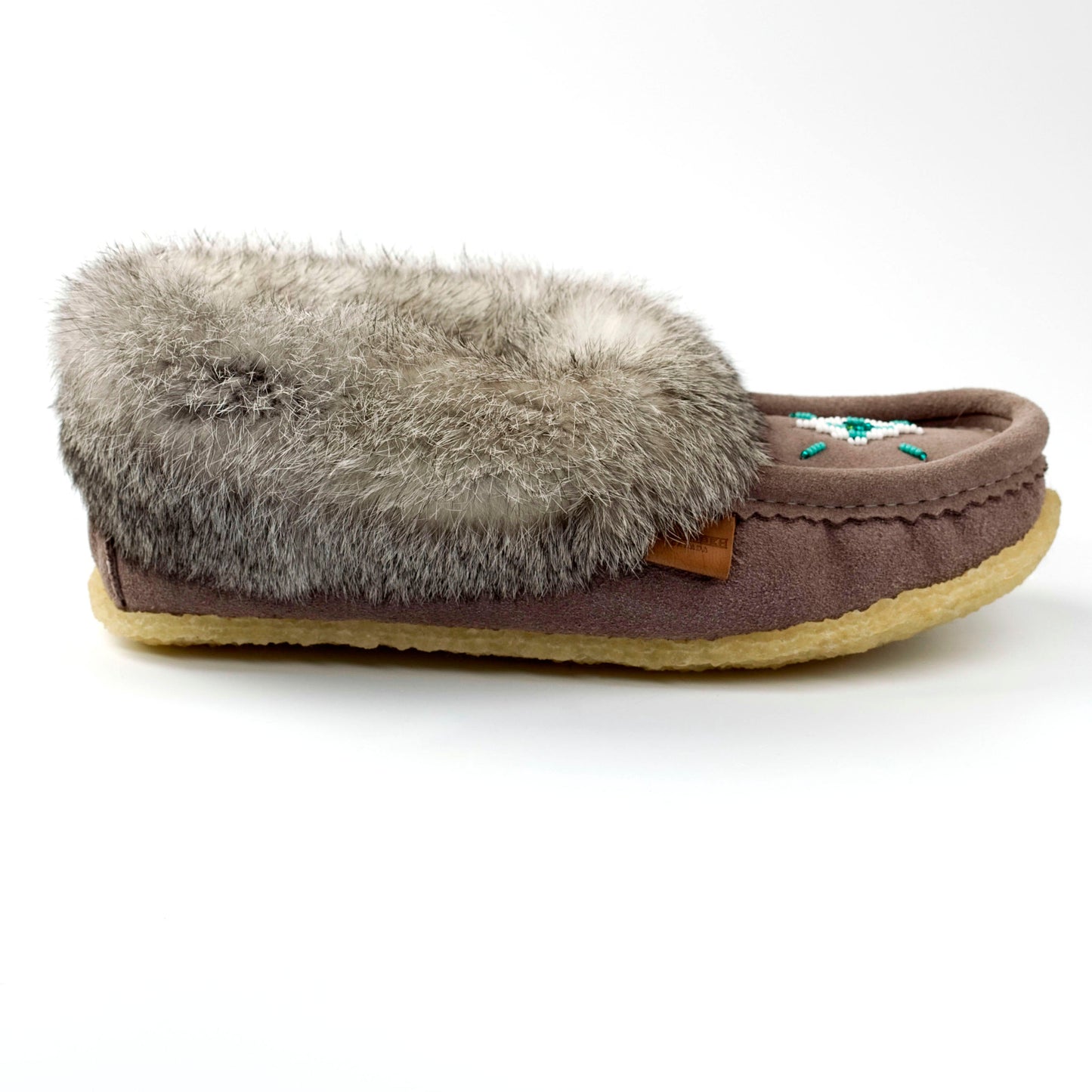 grey slipper with gray fur on a white background