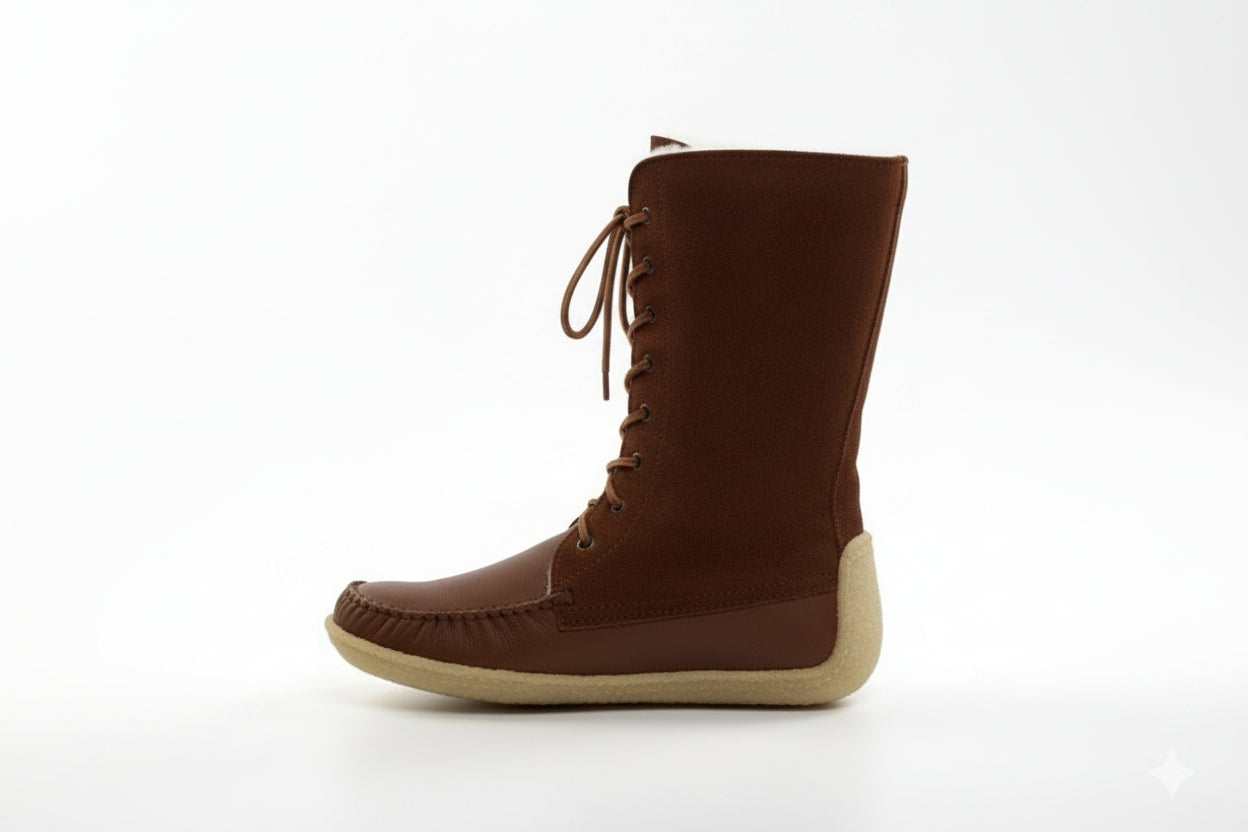 Brown lace-up boot on a white background