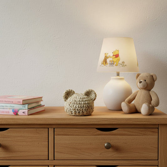 Crocheted bear-shaped beanie hat on a wooden surface with a neutral background