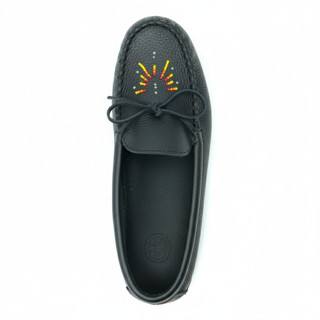 Black moccasin shoe with a colorful design on a white background