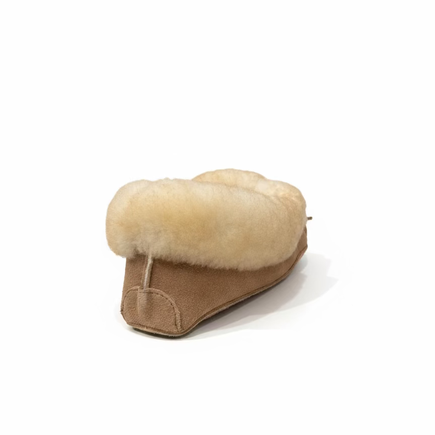 Brown moccasin with fur trim on a kitchen counter