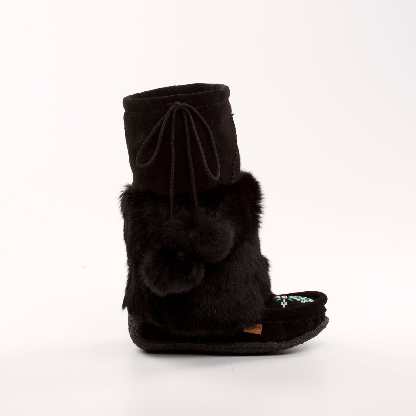 Black fur boot with a bow on a white background