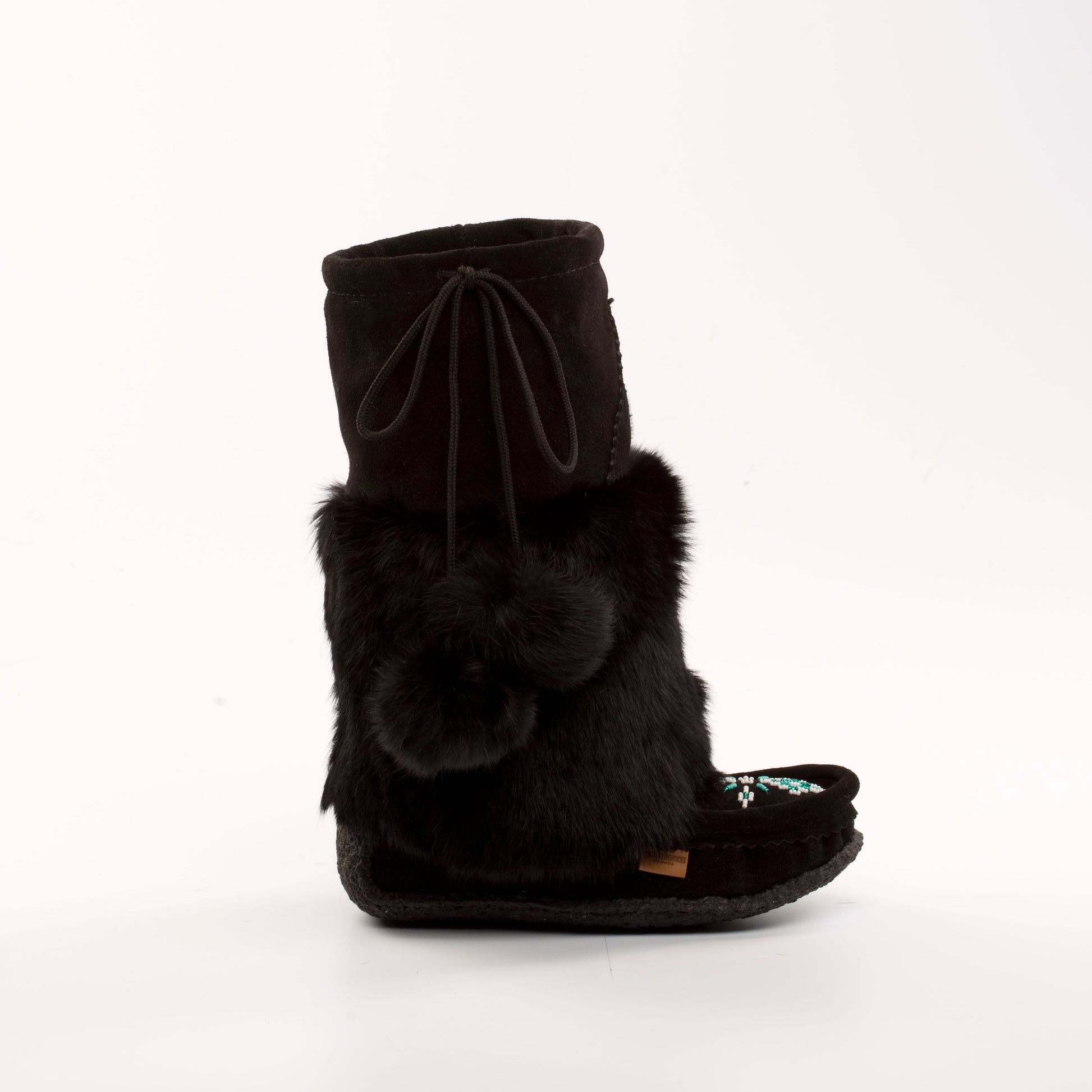 Black fur boot with a bow on a white background