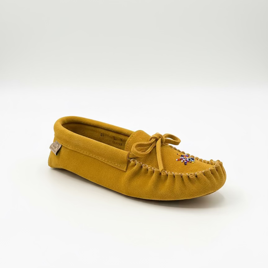 Yellow moccasin shoe on a white background
