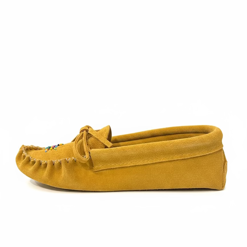 Yellow moccasin slipper on a white background