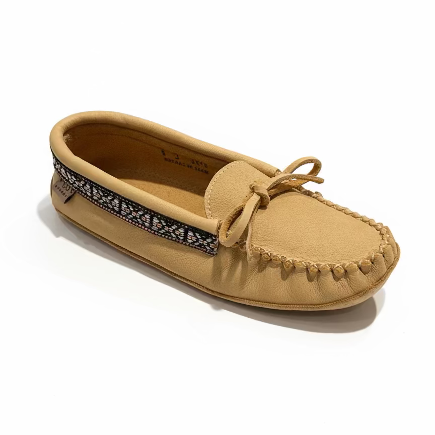 Beige moccasin shoe on a white surface