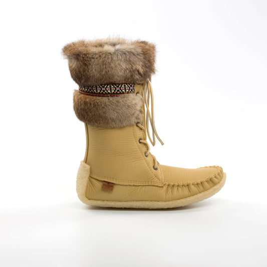 Tan boot with fur trim on a white background