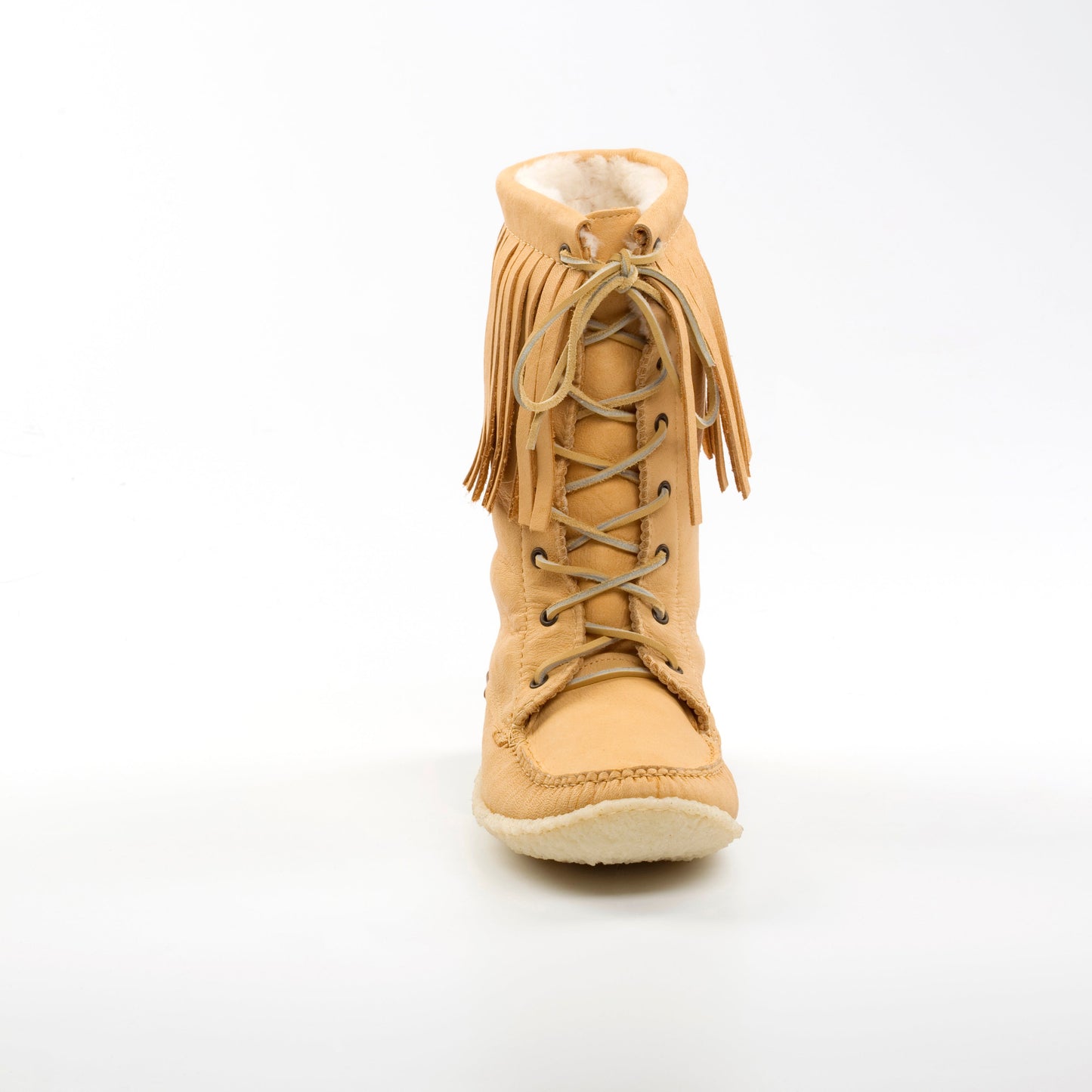 Tan fringed boot on a white background