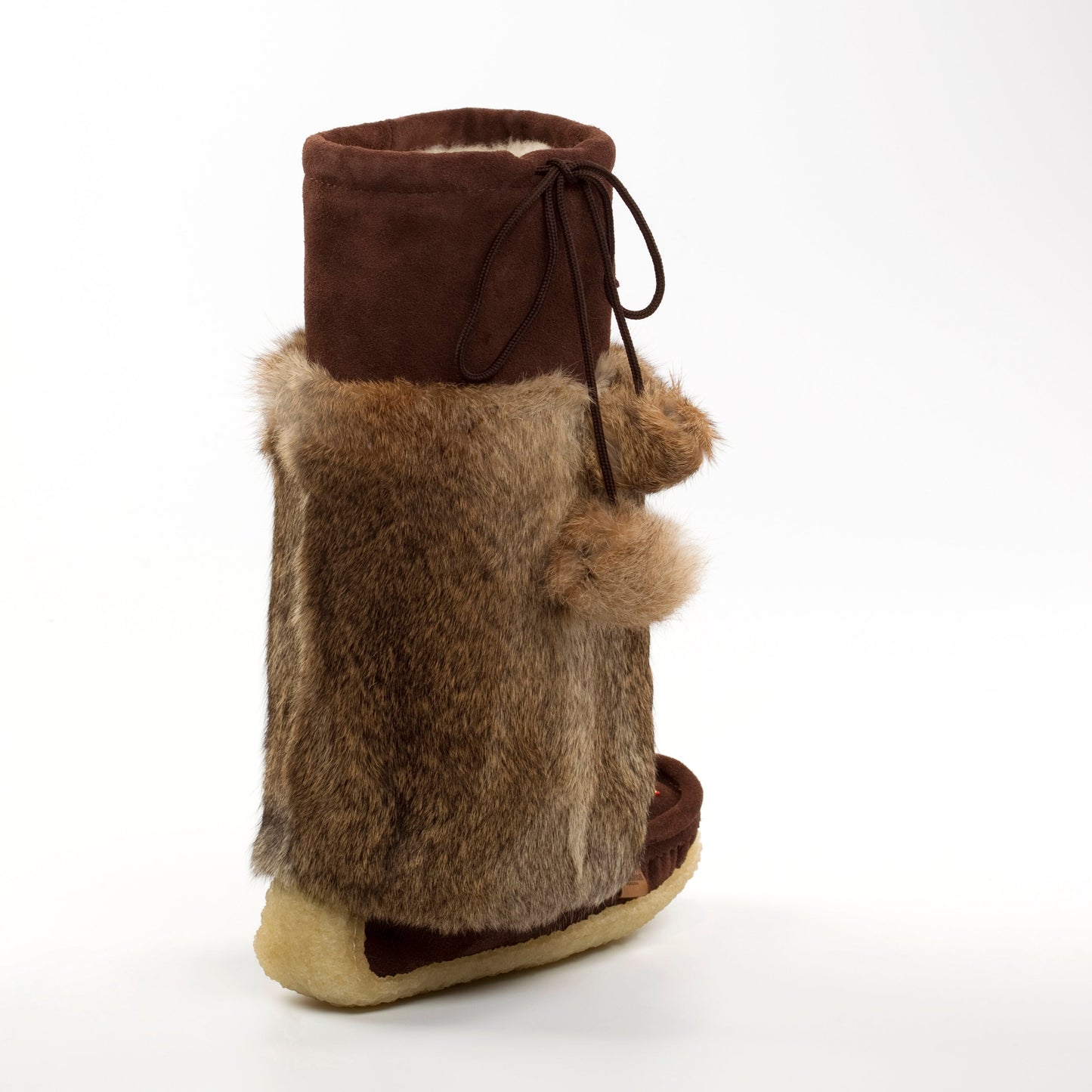 Brown fur mukluks with a white background