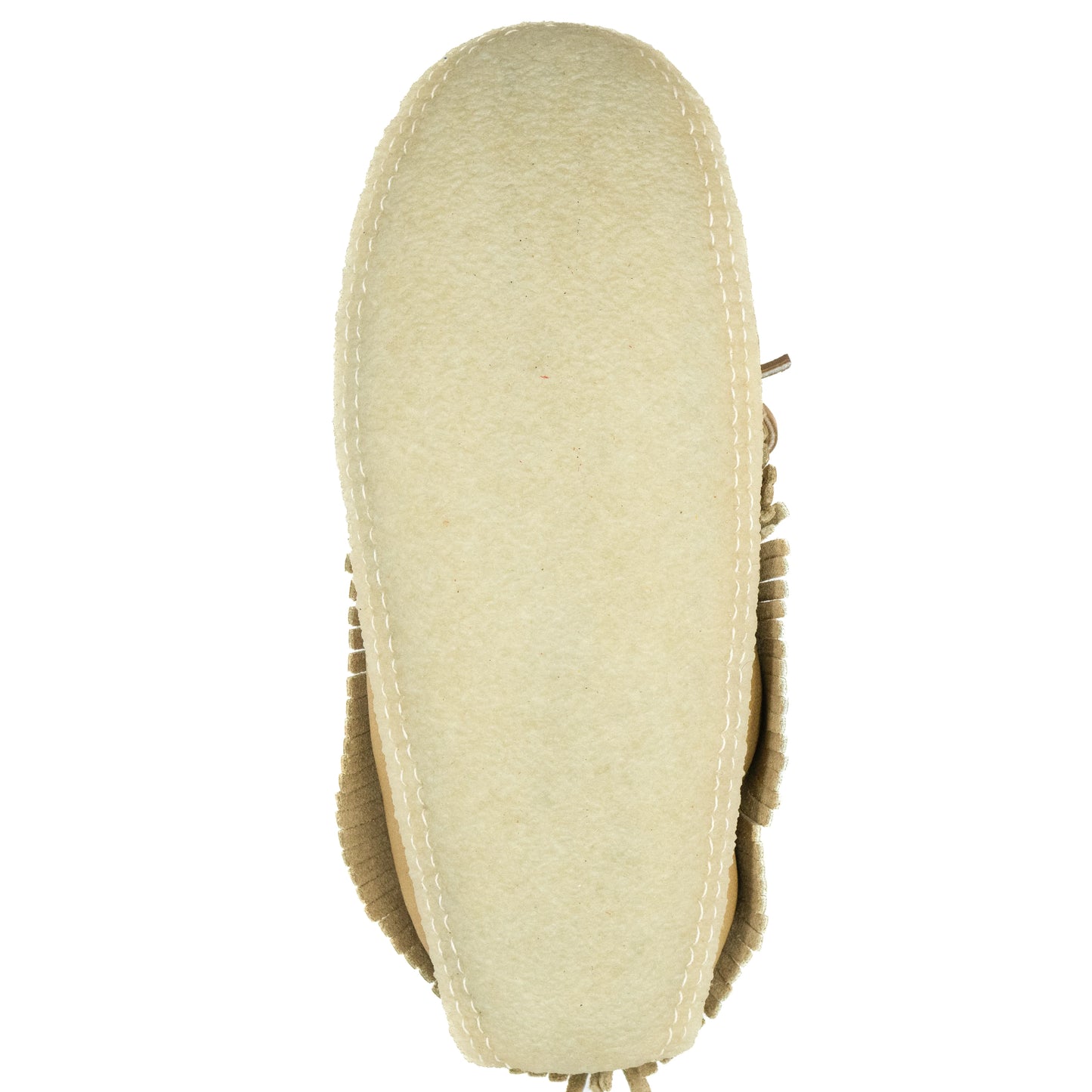 Close-up of a beige shoe sole on a white background