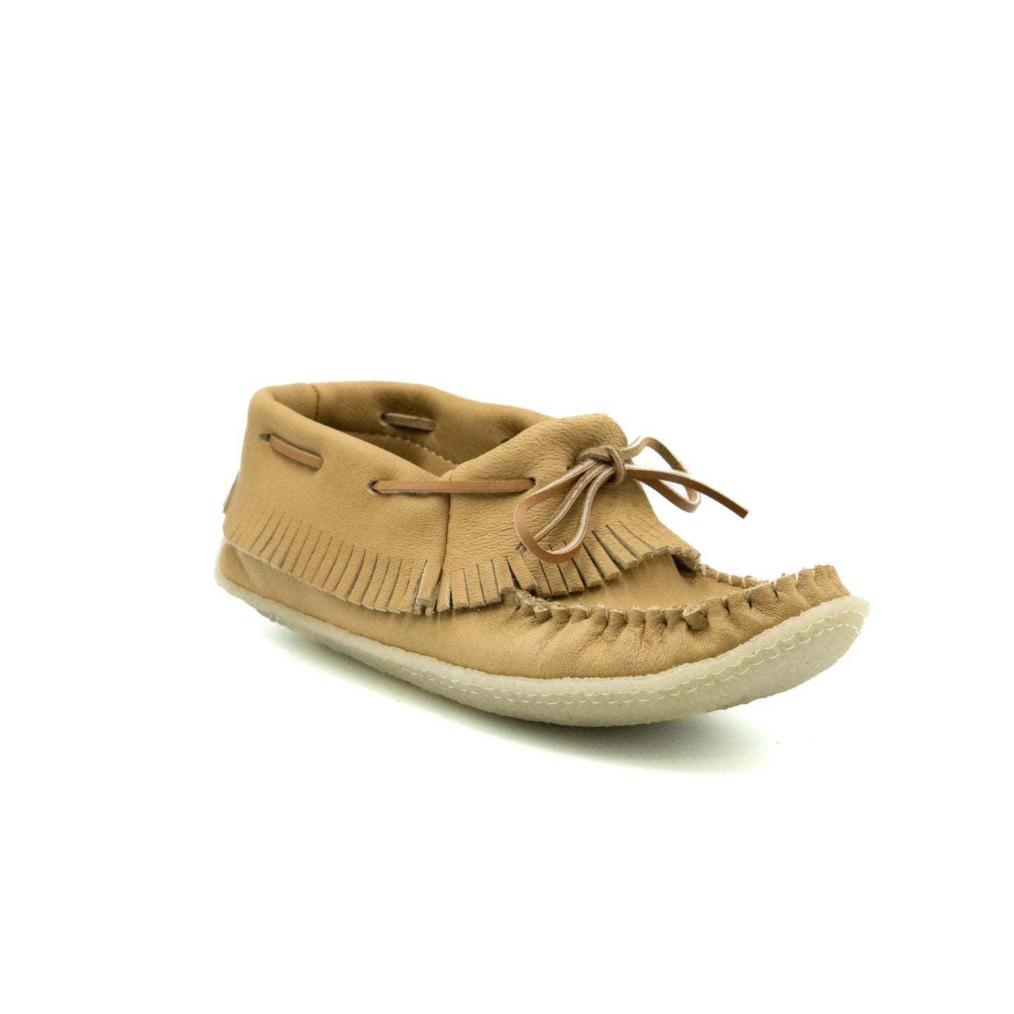 Tan moccasin shoe with fringes on a white background