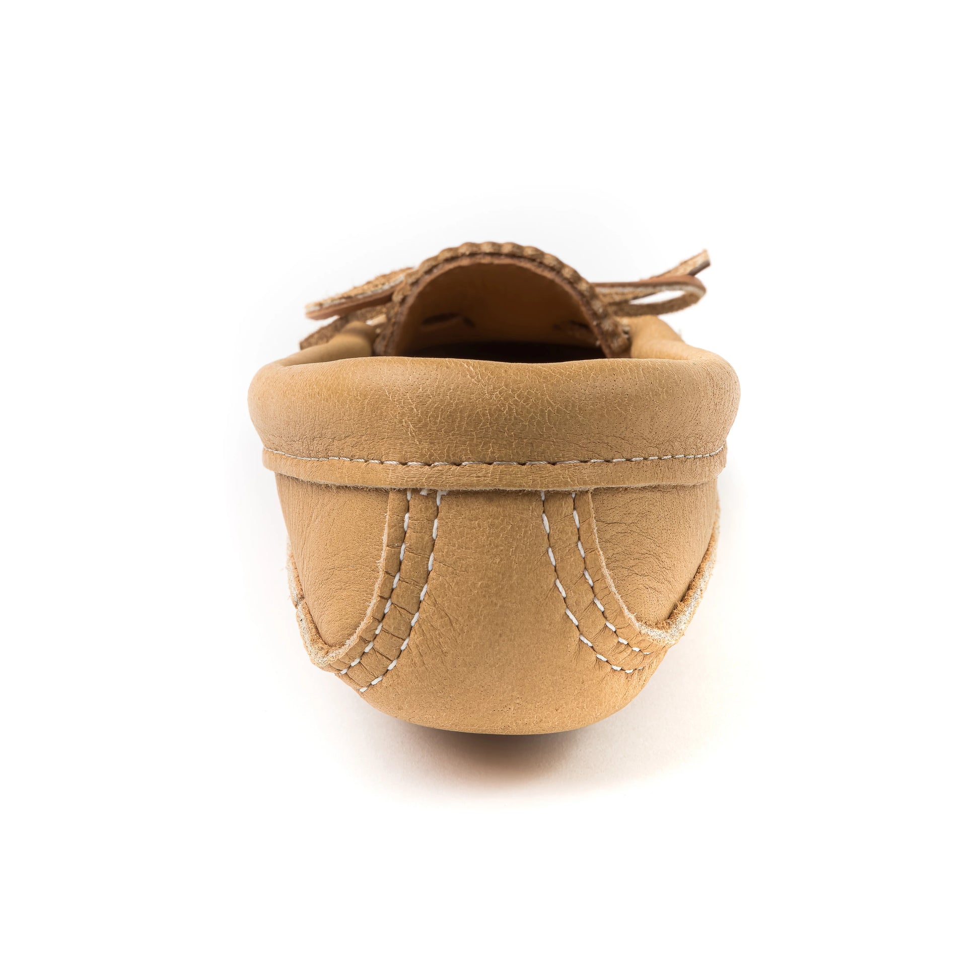 Tan womens moccasins on a white background