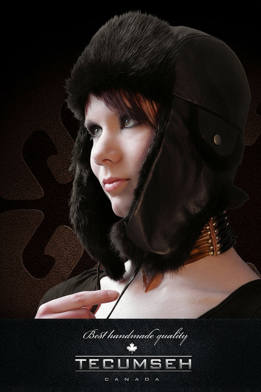 Person wearing a dark helmet with fur lining, brand 'Tecumseh' visible