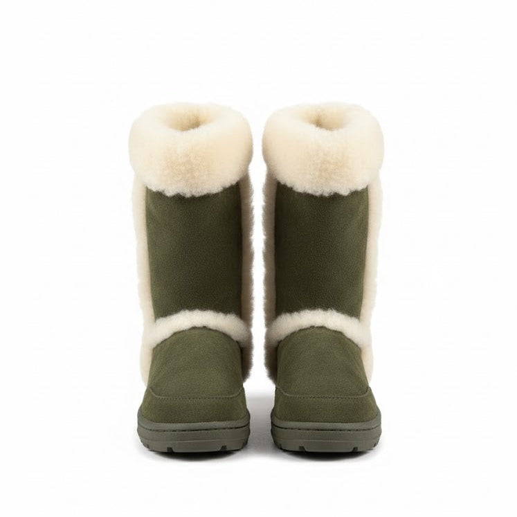 Pair of green boots with white fur lining on a white background