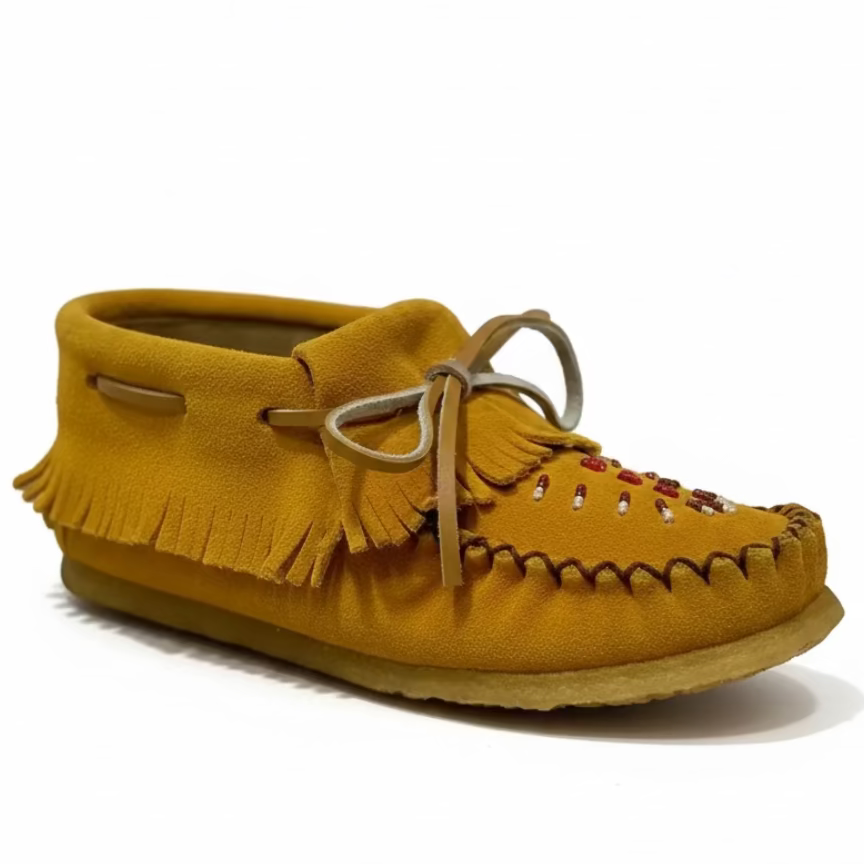 Yellow moccasin shoe with fringes on a white background