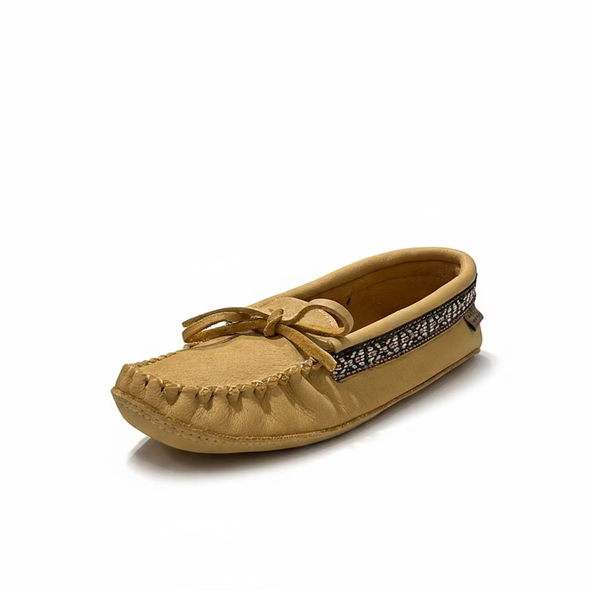 Tan moccasin shoe with decorative band on a white background